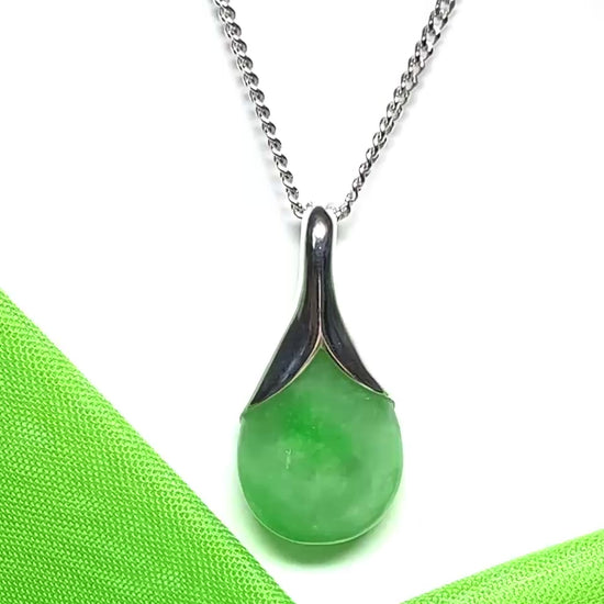 A real green jade necklace teardrop with a pear shaped pendant