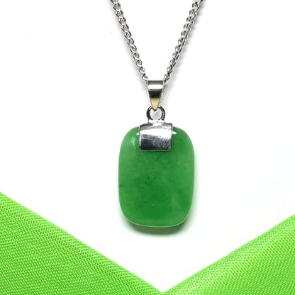 A necklace pendant having a real green jade sterling silver cushion shaped