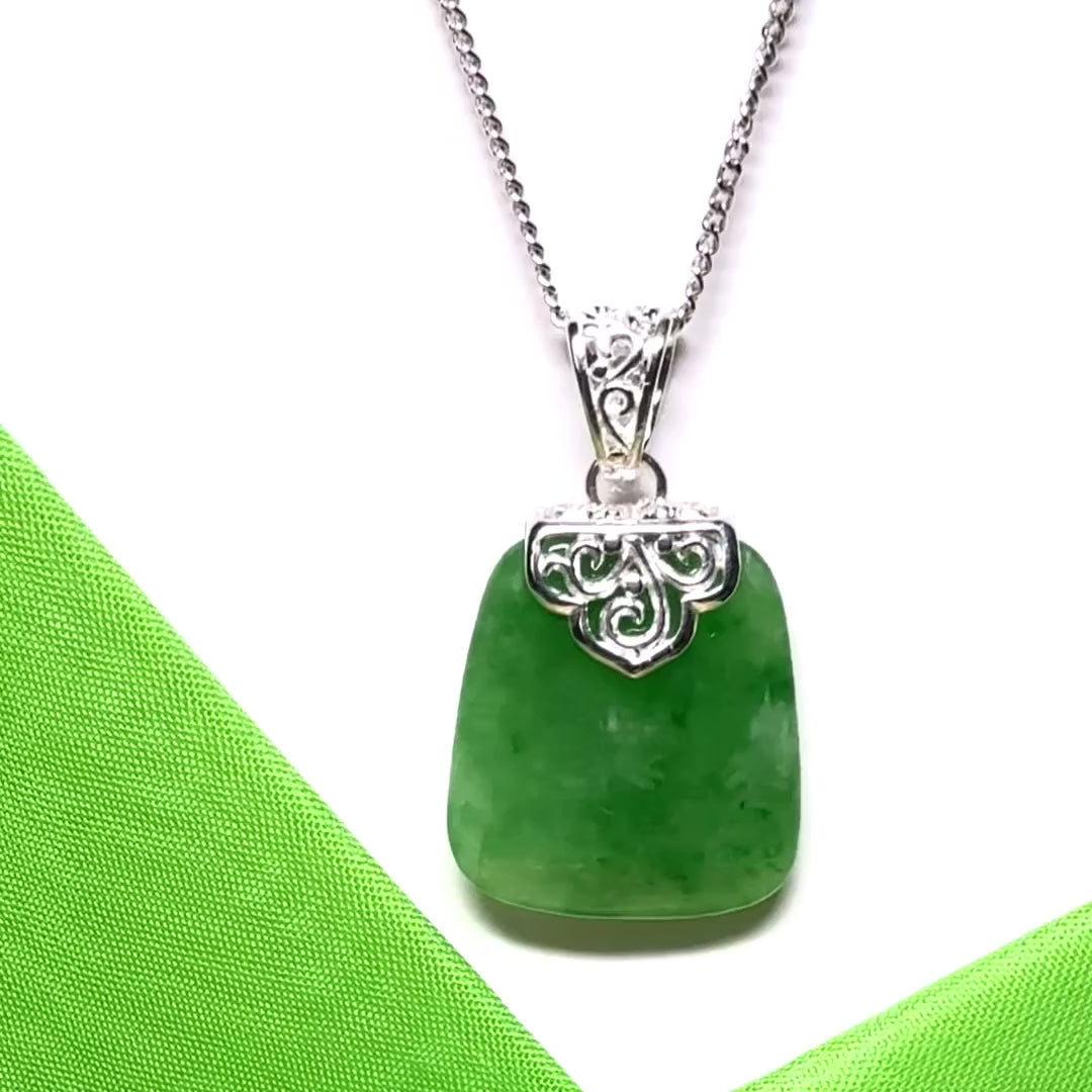 A beautiful and timeless real green jade necklace large cushion shaped with a chain included