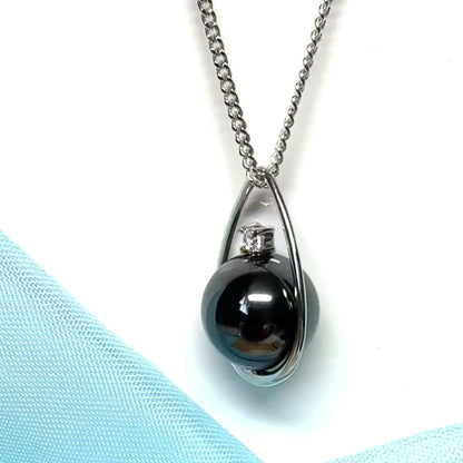 Real grey hematite necklace round inside a teardrop caged pendant