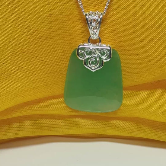 Necklace with a real green jade stone, large necklace cushion shaped, a timeless designed pendant with solid chain included as well