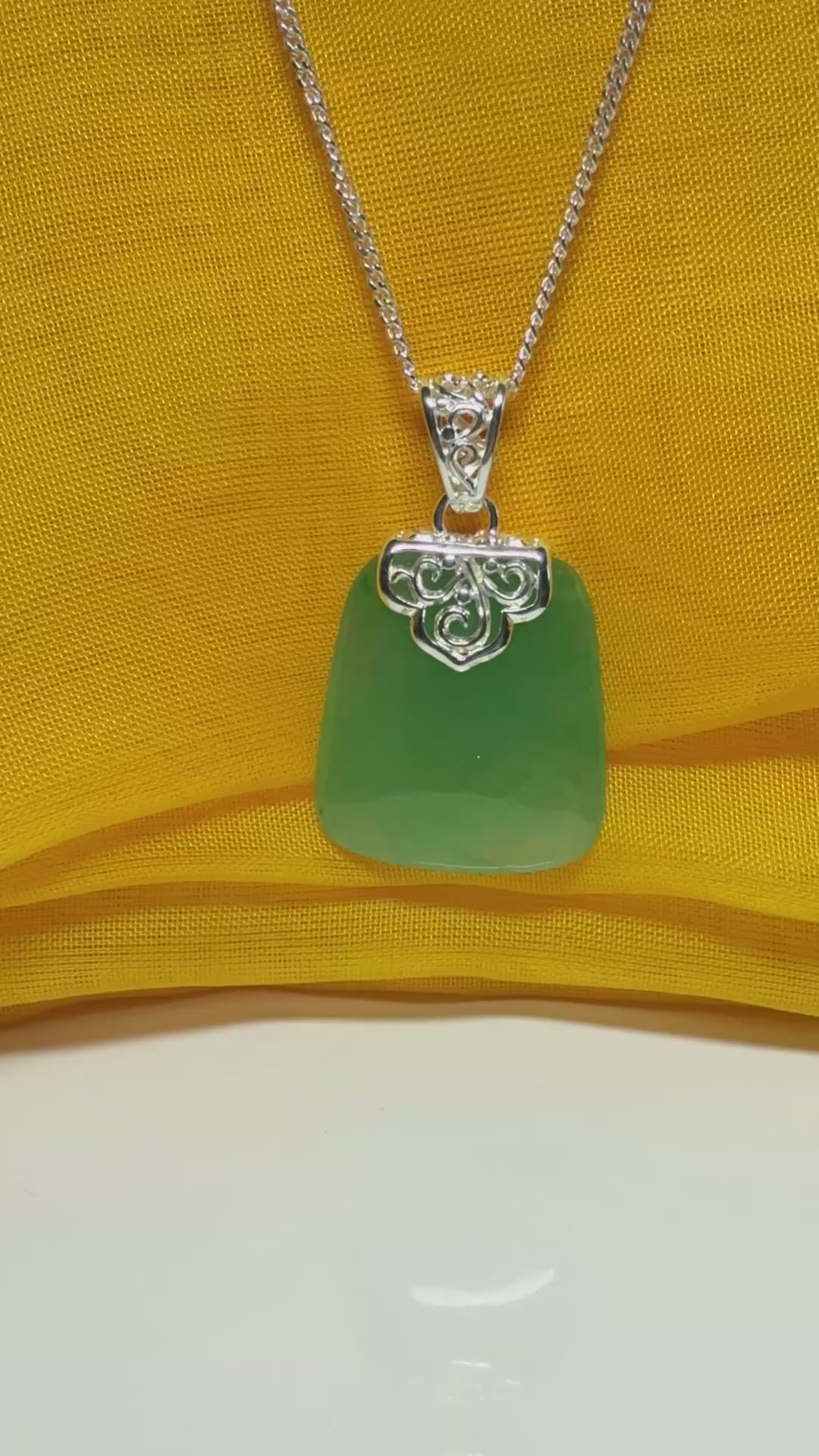 Necklace with a real green jade stone, large necklace cushion shaped, a timeless designed pendant with solid chain included as well