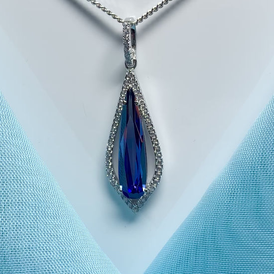 Video of a blue long drop necklace pear shaped cubic zirconia silver cluster pendant