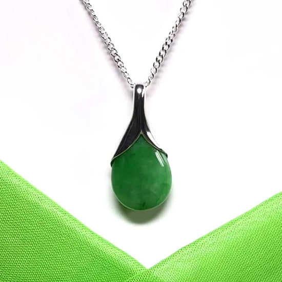 Real green jade tear drop dotted sterling silver pear shaped pendant including a solid chain