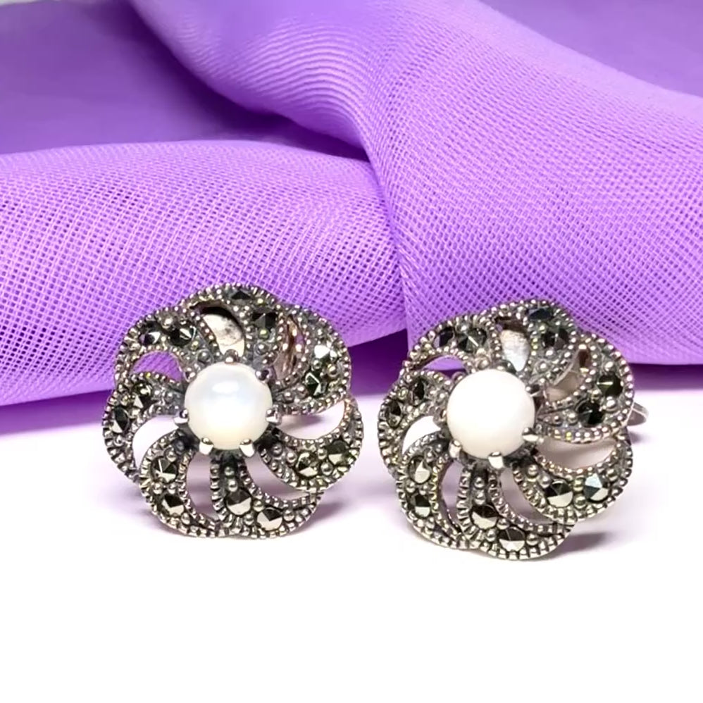 Round clip on earrings with marcasite and mother of pearl and sterling silver