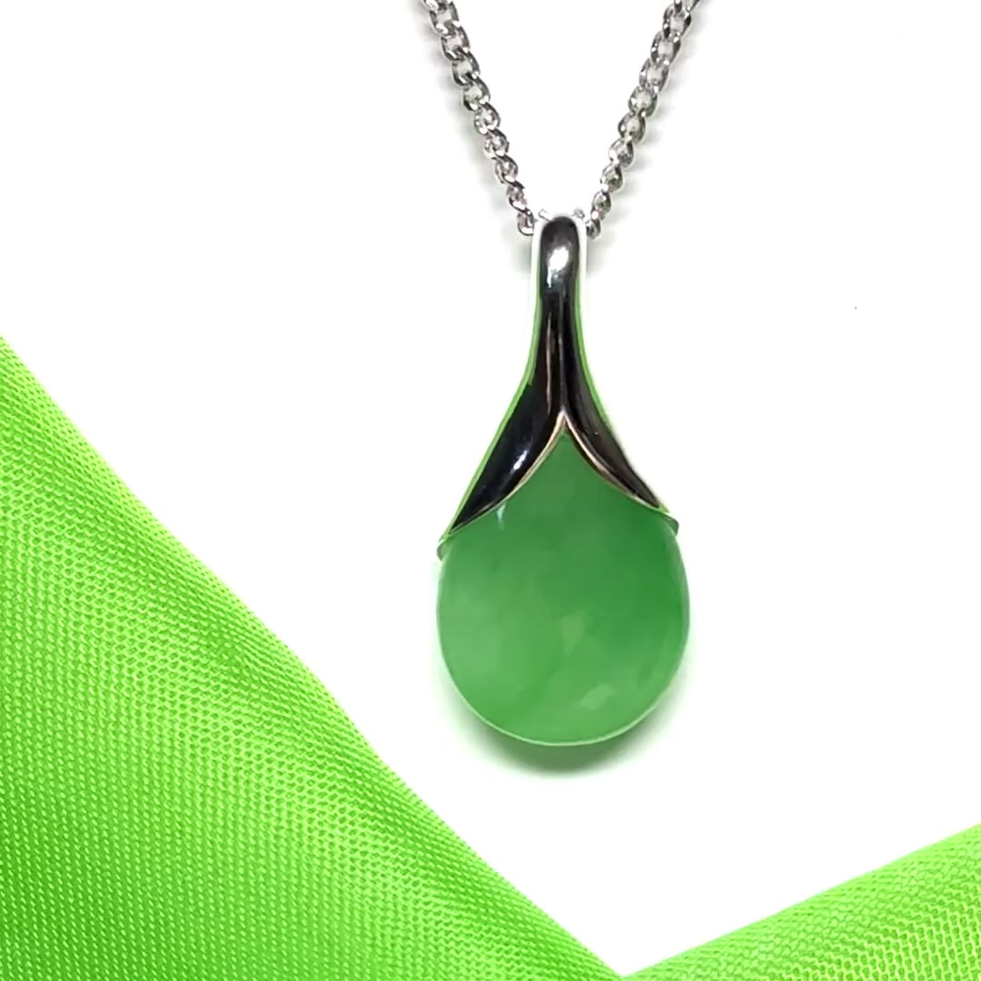 Real green jade necklace in a teardrop or pear shaped including a solid chain