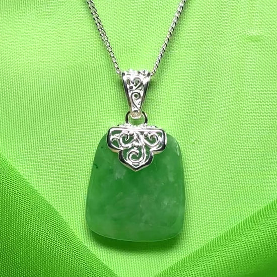 A beautiful and stunning real green jade necklace large pendant that is cushion shaped