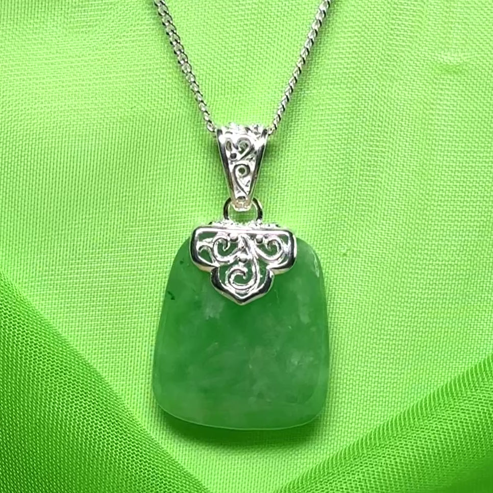 A beautiful and stunning real green jade necklace large pendant that is cushion shaped