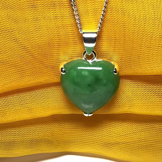 A real green jade necklace heart shape sterling silver pendant including chain