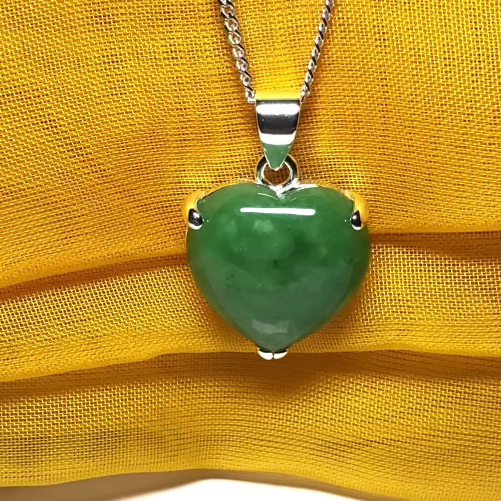 A real green jade necklace heart shape sterling silver pendant including chain