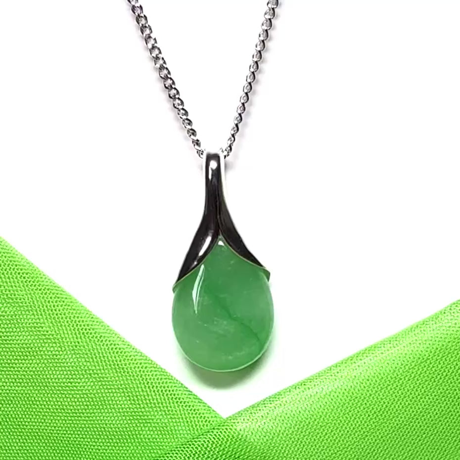A beautiful real green jade necklace teardrop with a pear shaped pendant, a distinctive design