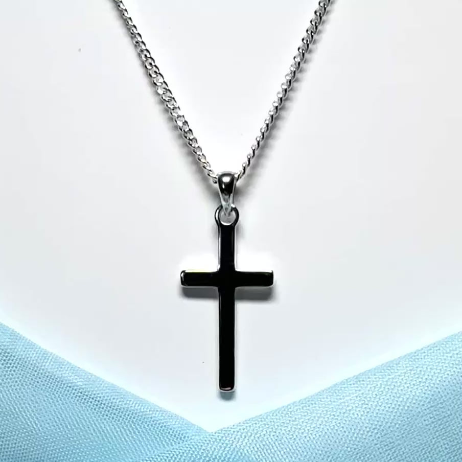 Polished plain solid sterling silver cross including a curb chain