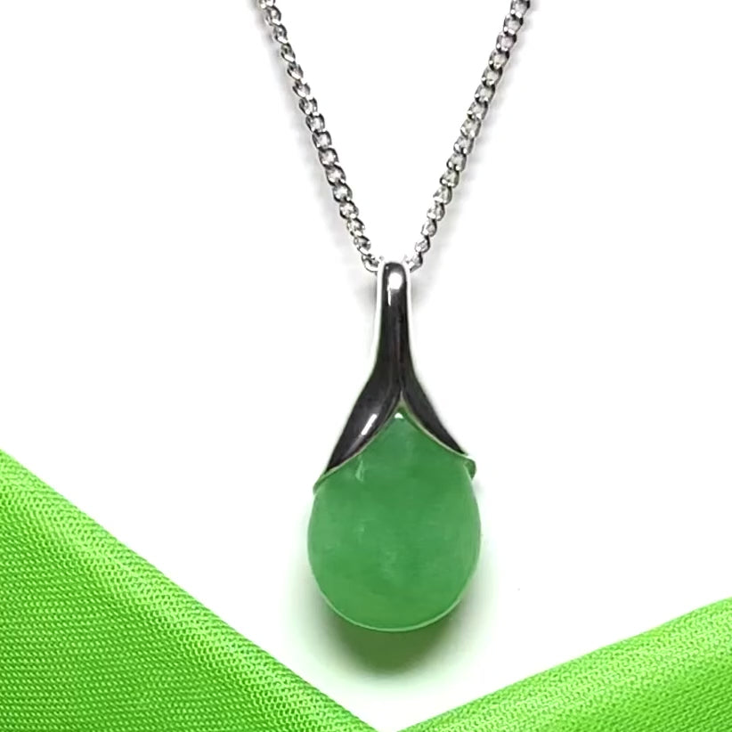 A real green jade pear shaped necklace in a teardrop pendant including a chain