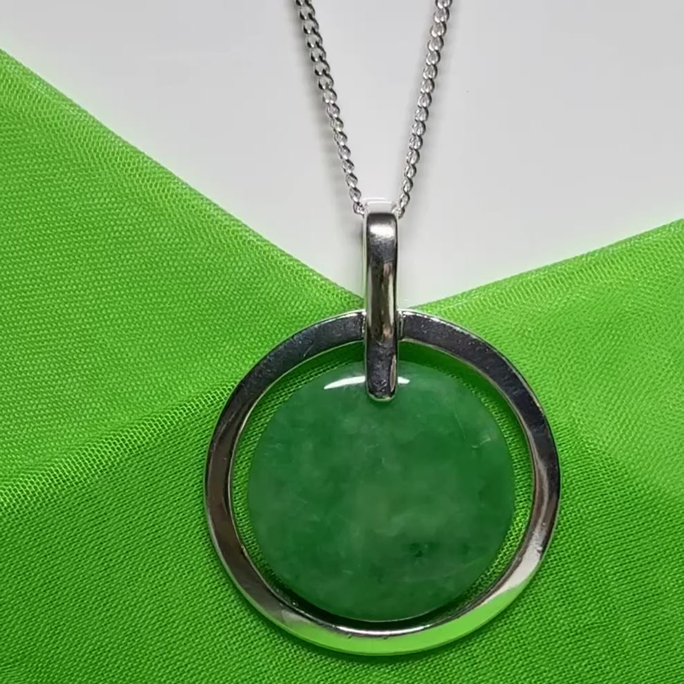 Large silver round shaped dark green real jade necklace with a chain