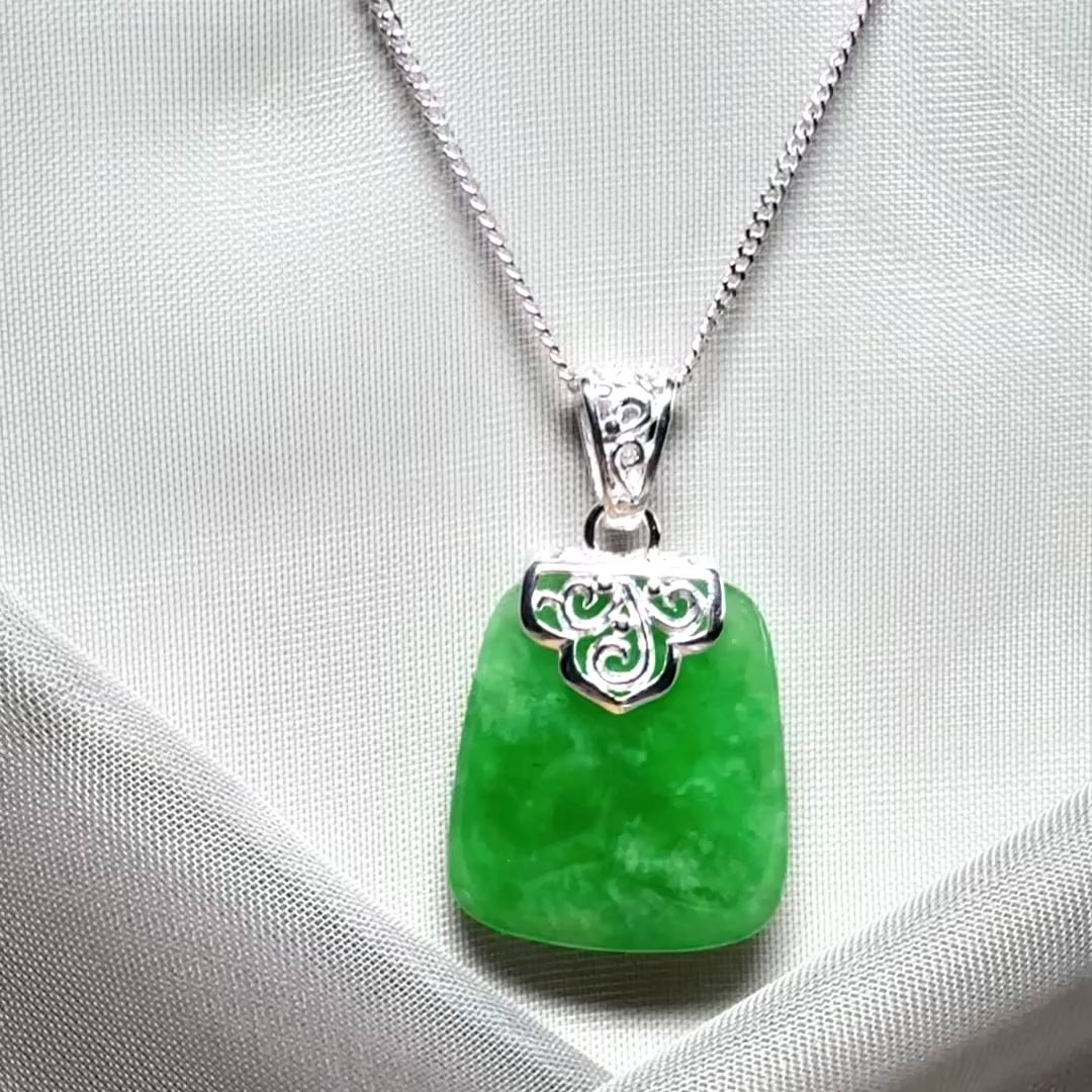 A beautiful and stunning real green jade necklace large pendant that is cushion shape