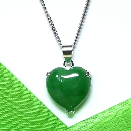 A real green jade necklace heart shape sterling silver pendant
