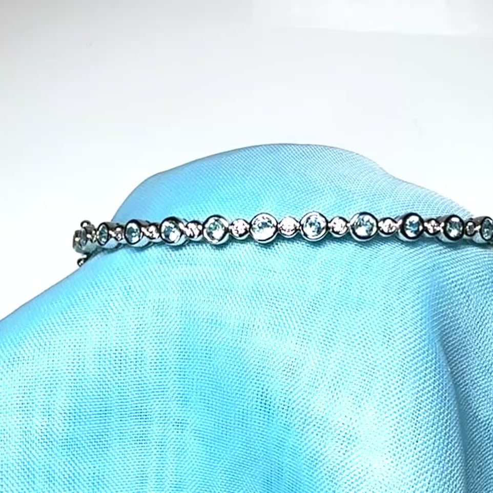 Sterling silver oval shaped real blue topaz cubic zirconia bangle