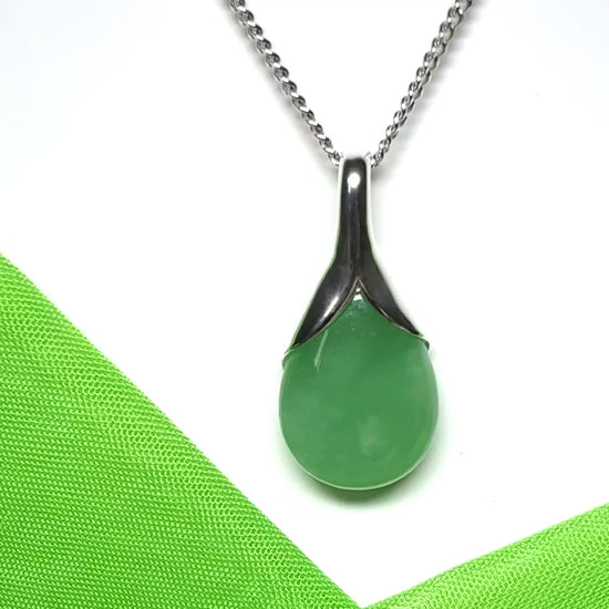 A real green jade necklace in a teardrop or pear shaped including a chain and gift box