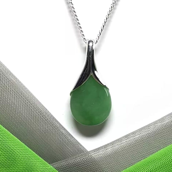 A really stunning real green jade necklace in a teardrop, a timeless design