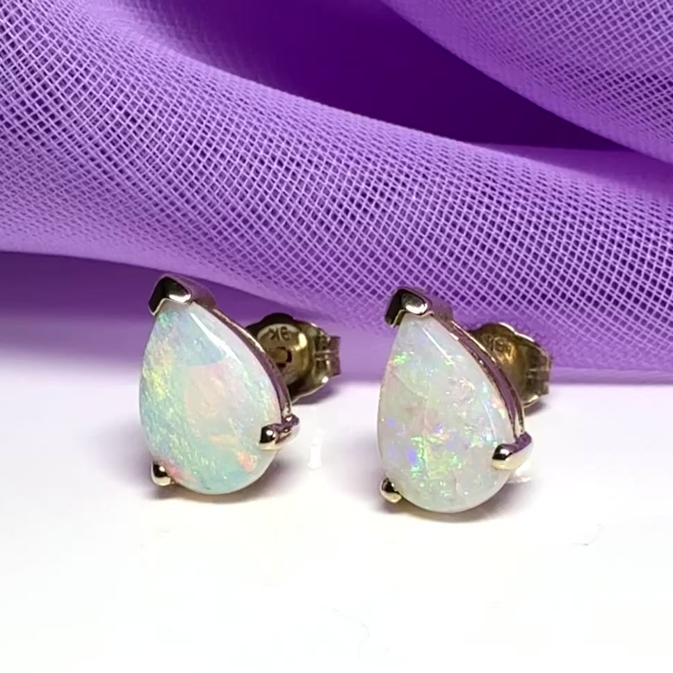 Real opal stud earrings Yellow gold claw setting with teardrop stones