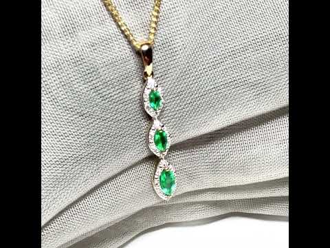 A video of a Real emerald and diamond necklace triple trilogy cluster pendant yellow gold