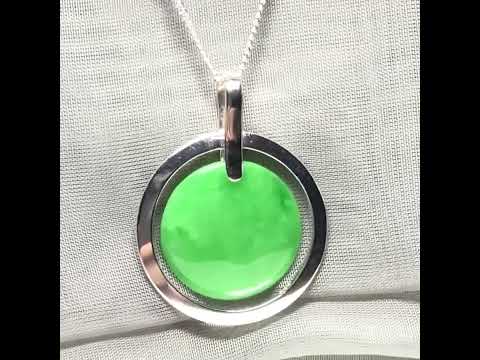 A large sterling silver green real jade necklace halo style, a gorgeous designed round pendant with chain