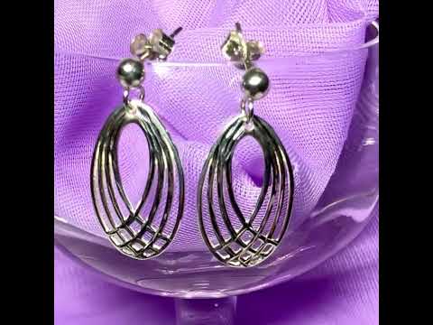 Video of a pair of oval shaped open drop earrings sterling silver