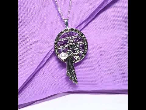 Video of a real cultured freshwater pearl and real marcasite sterling silver necklace lady sitting