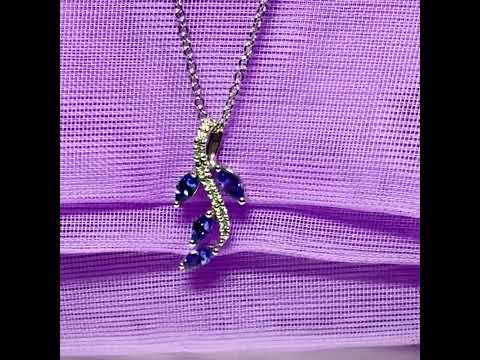 Video of a Tanzanite and diamond white Gold fancy spray necklace