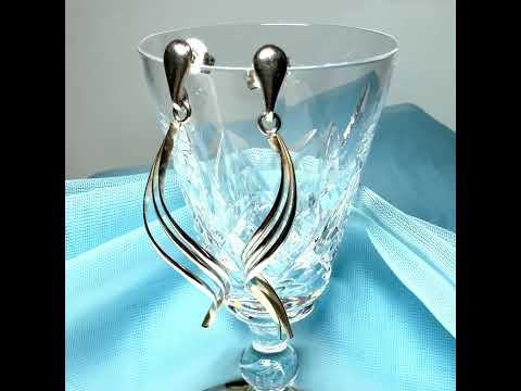 Video of a pair of long fancy swirl drop earrings sterling silver