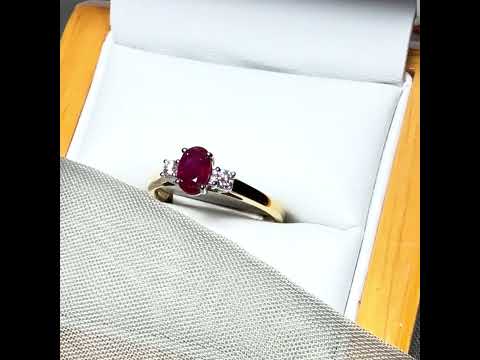 Video of a real ruby and diamond yellow gold three stone trilogy ring