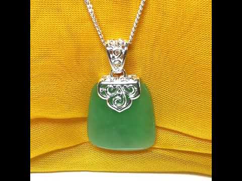 A beautiful and stunning real green jade necklace large pendant that is cushion in shape