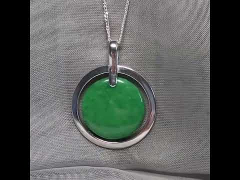 A large sterling silver round shaped green real jade necklace halo style, a stunning and timeless pendant design