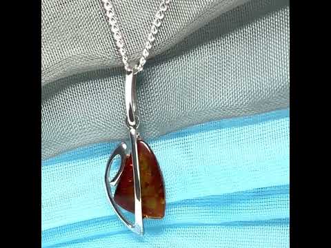 A real amber necklace sterling silver fancy open triangle shaped amber pendant