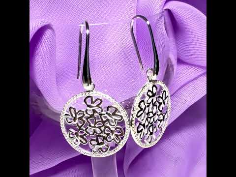 Video of a pair of sterling silver round shaped drop earrings with an open pierced design