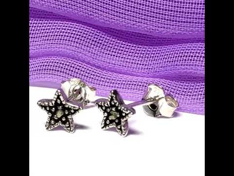 Video of a Pair of Small marcasite stud earrings star sterling silver