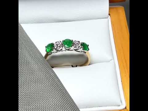 Video of a Real emerald and diamond yellow gold eternity ring claw setting