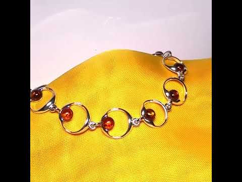 Video of a real amber round shaped open link sterling silver