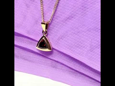 Video of a Real garnet necklace triangle shaped yellow gold pendant with a chain included