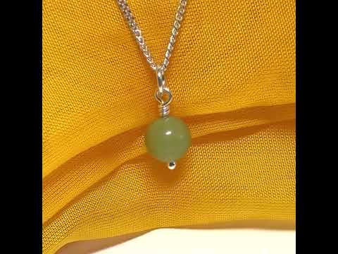 A small real green gypsum necklace ball shaped, a really gorgeous round pendant with chain