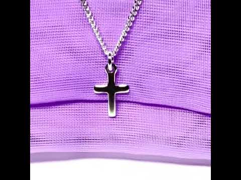 Video of a very small cross solid plain polished sterling silver including chain