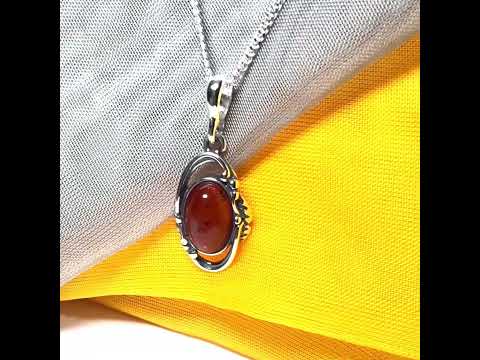 Orange real amber oval sterling silver necklace with a swirl set open pendant With chain