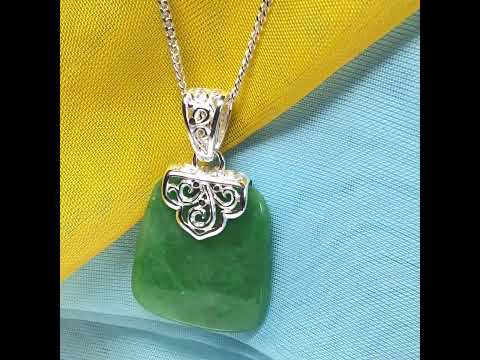 A stunning, a real green jade necklace large shaped with a patterned top pendant