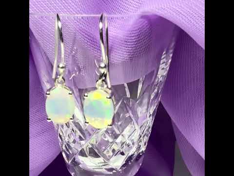 Video of Real opal sterling silver oval shaped drop earrings