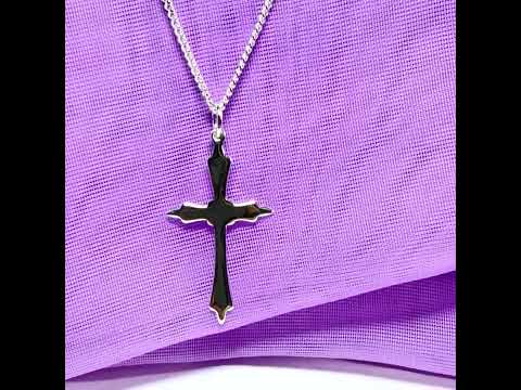 A solid fancy shaped sterling silver cross necklace pendant with a chain included