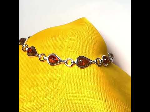 A video of a real amber sterling silver pear shaped bracelet