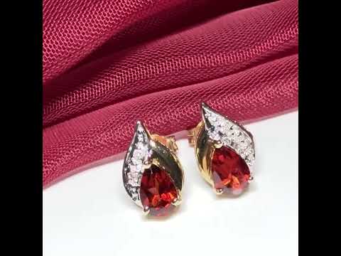 Vidoe of Real garnet and real diamond stud earrings pear shaped yellow gold teardrop