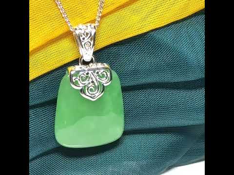 A beautiful and truly timeless real green jade necklace large pendant that is cushion shaped