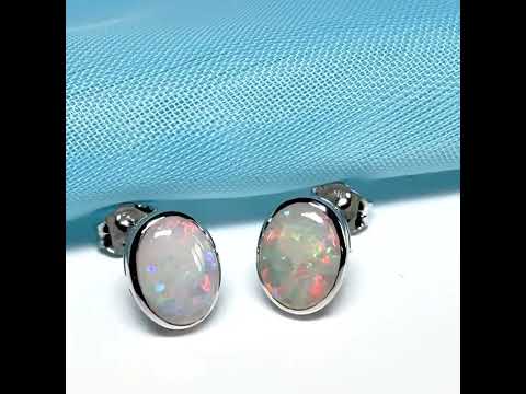 Pair of real opal white gold oval stud earrings