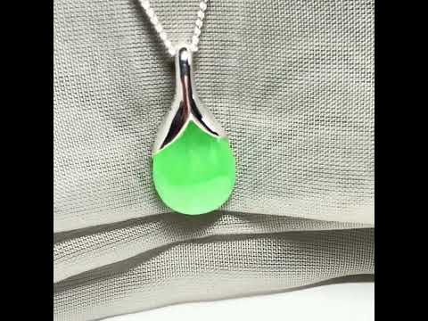 A really gorgeous real green jade necklace in a teardrop or pear shape, a really exquisite designed pendant